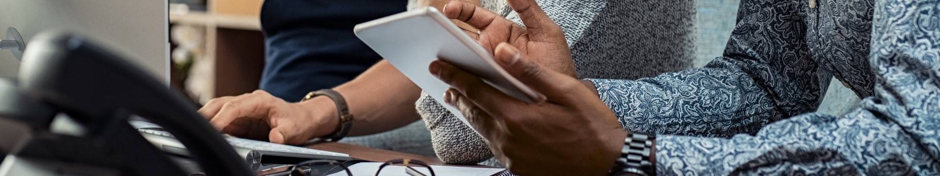 Business people with tablet discuss meeting